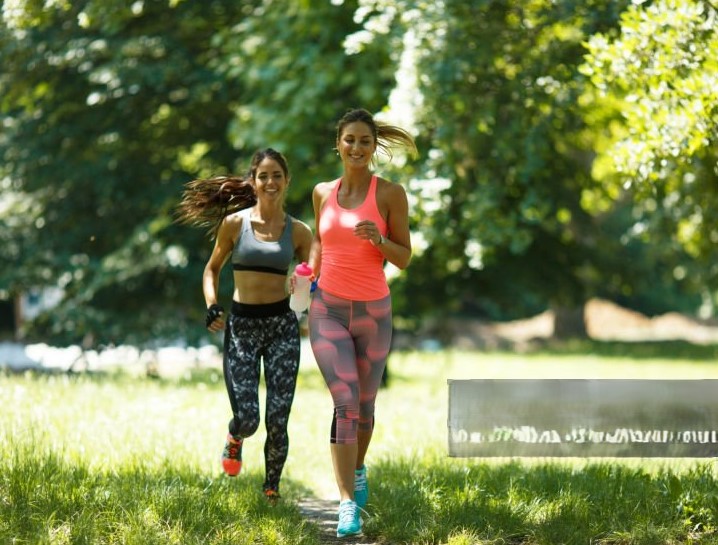 Two runners training together on Toronto's waterfront